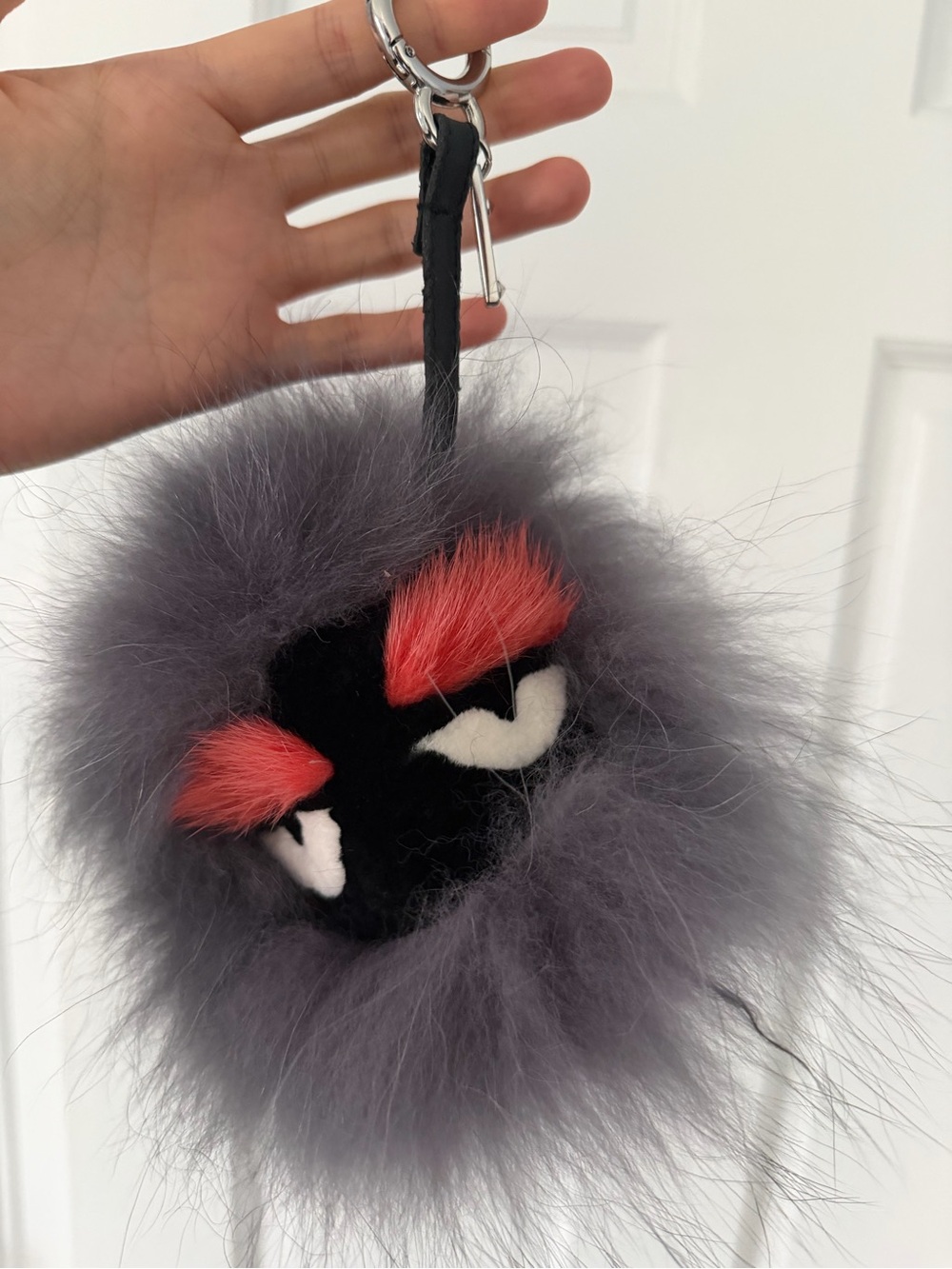 Fendi Gray Fur Monster Pom Keychain with Red Accent Eyebrows